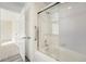 Clean bathroom with a shower/tub and glass sliding doors at 897 S Granby Cir, Aurora, CO 80012