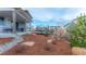 Backyard with covered patio and trampoline surrounded by rocks and mulch at 211 Luna Ct, Erie, CO 80516