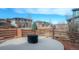 Backyard patio with fence overlooking other homes in the neighborhood at 211 Luna Ct, Erie, CO 80516