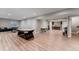 Large basement area with a pool table, foosball, and a kitchenette in the background at 211 Luna Ct, Erie, CO 80516