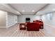 Spacious finished basement with recessed lighting and red sofas, perfect for entertaining at 211 Luna Ct, Erie, CO 80516