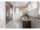 A luxurious bathroom with a glass-enclosed shower and soaking tub at 211 Luna Ct, Erie, CO 80516
