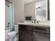 Bathroom boasting modern vanity, with bronze fixtures and a tub with tiled walls at 211 Luna Ct, Erie, CO 80516