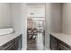 View of the dining room through a hallway with cabinetry at 211 Luna Ct, Erie, CO 80516