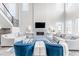 Elegant living room with stylish fireplace and bright, open floor plan at 211 Luna Ct, Erie, CO 80516