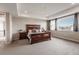 Spacious main bedroom with mountain view and ample natural light at 211 Luna Ct, Erie, CO 80516