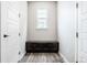 Mudroom with built-in bench and storage, enhancing organization at 211 Luna Ct, Erie, CO 80516