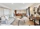 Spacious finished basement area with bar, living area, carpet flooring and neutral paint at 9957 Candlewood Ln, Highlands Ranch, CO 80126