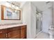 Stylish bathroom featuring granite countertops, vanity, and a glass-enclosed shower at 9957 Candlewood Ln, Highlands Ranch, CO 80126