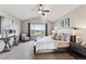 Serene main bedroom with a vaulted ceiling, abundant natural light, and scenic views at 9957 Candlewood Ln, Highlands Ranch, CO 80126