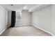 Empty bedroom with neutral walls, carpet flooring, and a window with natural light at 9957 Candlewood Ln, Highlands Ranch, CO 80126
