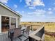 Relaxing outdoor deck with comfortable seating, offering stunning views of the surrounding landscape at 9957 Candlewood Ln, Highlands Ranch, CO 80126