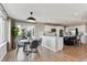 Open dining area with a modern light fixture, seamlessly connected to the kitchen, ideal for entertaining at 9957 Candlewood Ln, Highlands Ranch, CO 80126