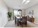 Well-lit dining area featuring modern chandelier, dining table with scenic view at 9957 Candlewood Ln, Highlands Ranch, CO 80126