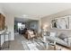 Inviting living room and dining area with natural light and modern decor at 9957 Candlewood Ln, Highlands Ranch, CO 80126