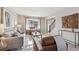 Cozy living room featuring contemporary furniture, natural light, and warm color palette at 9957 Candlewood Ln, Highlands Ranch, CO 80126