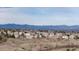 Picturesque view of a peaceful residential neighborhood with beautiful houses and scenic mountain views at 9957 Candlewood Ln, Highlands Ranch, CO 80126