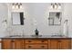 Double vanity bathroom with dark wood cabinets at 1312 Jade Ln, Longmont, CO 80504