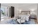 Spacious bedroom with king bed, sitting area, and view at 1312 Jade Ln, Longmont, CO 80504