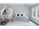 Spacious bedroom with a king-size bed and access to en-suite bathroom at 1312 Jade Ln, Longmont, CO 80504