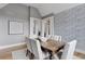 Formal dining room with hardwood floors and a decorative wall at 1312 Jade Ln, Longmont, CO 80504