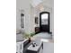 Elegant entryway with high ceilings and a modern light fixture at 1312 Jade Ln, Longmont, CO 80504