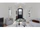 Bright and spacious entryway with high ceilings and a stylish chandelier at 1312 Jade Ln, Longmont, CO 80504