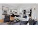 Open concept kitchen and living area with white cabinets and island at 1312 Jade Ln, Longmont, CO 80504