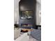 Living room with a modern fireplace and large TV at 1312 Jade Ln, Longmont, CO 80504