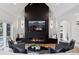 Spacious living room features a modern fireplace and built-in shelving at 1312 Jade Ln, Longmont, CO 80504