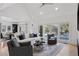 Bright and airy living room with hardwood floors and large windows at 1312 Jade Ln, Longmont, CO 80504