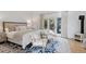 Main bedroom with king bed and access to backyard at 1312 Jade Ln, Longmont, CO 80504
