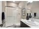 Elegant bathroom features a glass shower, a vanity with ample counter space, and modern fixtures at 878 Tree Bark Ter, Colorado Springs, CO 80132