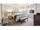 Bright bedroom with large bed, plush carpet, and dresser providing a comfortable retreat at 878 Tree Bark Ter, Colorado Springs, CO 80132