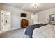 Comfortable bedroom with tv, ensuite bathroom, and dresser for additional storage at 878 Tree Bark Ter, Colorado Springs, CO 80132