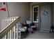Inviting front porch with comfortable seating, a small fire pit, and a welcoming floral wreath on the front door at 878 Tree Bark Ter, Colorado Springs, CO 80132