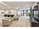 Spacious living room featuring modern furniture, large TV, and plenty of natural light, ideal for relaxing at 878 Tree Bark Ter, Colorado Springs, CO 80132