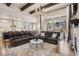 Bright living room with large windows offering great views and hardwood floors at 878 Tree Bark Ter, Colorado Springs, CO 80132