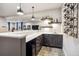 Stylish wet bar featuring modern cabinetry, ample counter space, and a wine rack, ideal for entertaining at 878 Tree Bark Ter, Colorado Springs, CO 80132