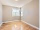 Neutral bedroom with hardwood floors, a large window and ample sunlight at 5843 S Danube St, Aurora, CO 80015