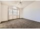 Bright and airy bedroom featuring vaulted ceilings, carpet floors, and a large window at 5843 S Danube St, Aurora, CO 80015