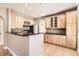 Spacious kitchen featuring wood cabinetry, granite countertops, stainless steel appliances, and hardwood floors at 5843 S Danube St, Aurora, CO 80015