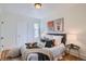 Bedroom featuring neutral walls and wood floors at 764 S Sherman St, Denver, CO 80209