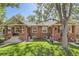 Charming exterior view of this brick home with a well maintained lawn and mature trees at 764 S Sherman St, Denver, CO 80209