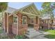 Charming brick home featuring a covered front porch with sturdy brick pillars at 764 S Sherman St, Denver, CO 80209