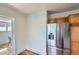 Kitchen with oak cabinets and a stainless steel refrigerator at 764 S Sherman St, Denver, CO 80209