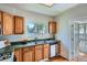 Traditional kitchen featuring wooden cabinets, a green countertop, and stainless steel appliances at 764 S Sherman St, Denver, CO 80209