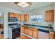 Traditional kitchen featuring wooden cabinets, a green countertop, and stainless steel appliances at 764 S Sherman St, Denver, CO 80209