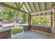 Covered front porch featuring brick pillars and a concrete floor, offering a cozy outdoor space at 764 S Sherman St, Denver, CO 80209