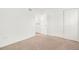 Bedroom with neutral carpeting, double closets, and access to a hallway at 1150 Inca St # 59, Denver, CO 80204
